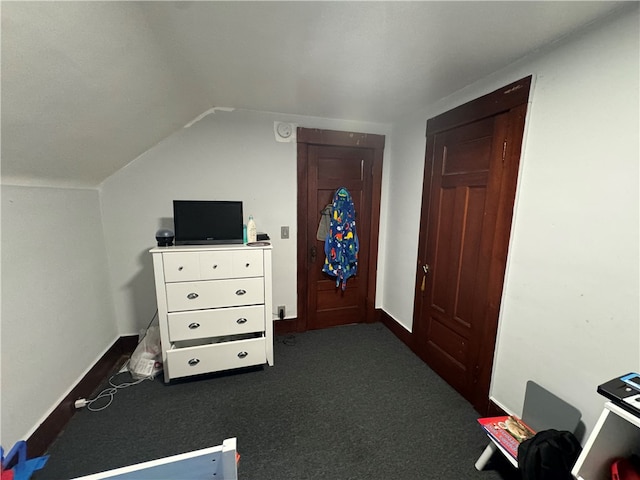 carpeted bedroom featuring lofted ceiling