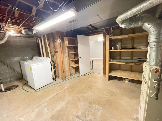 basement featuring washing machine and clothes dryer