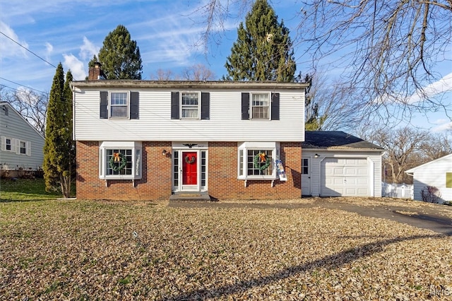 colonial home with a garage