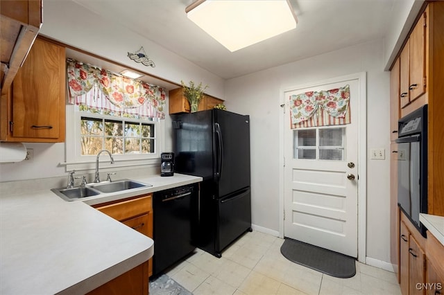 kitchen featuring black appliances and sink