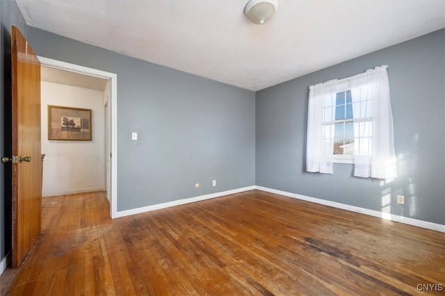 spare room featuring hardwood / wood-style flooring