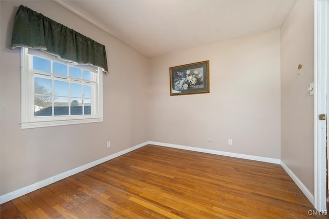 unfurnished room featuring wood-type flooring