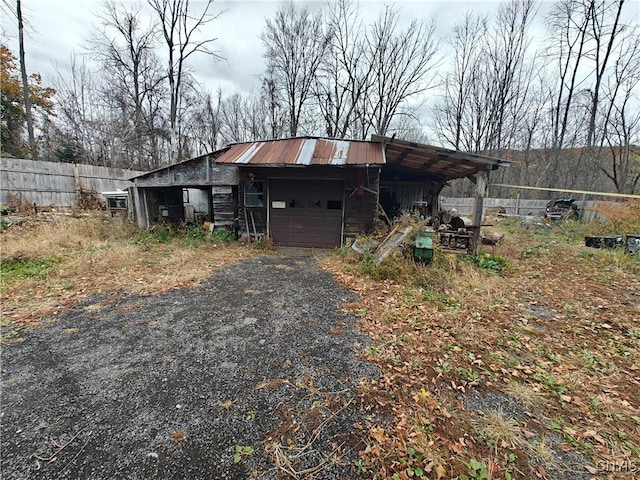 view of outbuilding with a carport