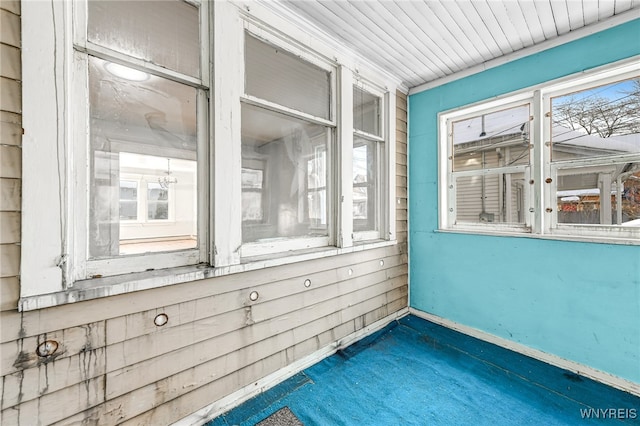 unfurnished sunroom featuring a wealth of natural light