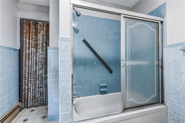 bathroom with tile patterned floors, shower / bath combination with glass door, tile walls, and a baseboard radiator