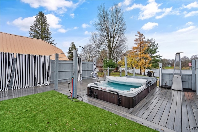 exterior space featuring a covered hot tub and a deck