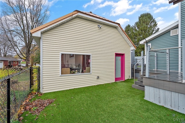 back of house with a lawn