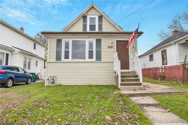 bungalow with a front yard