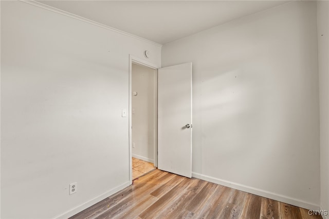 spare room with light wood-type flooring