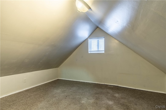 bonus room with carpet and lofted ceiling