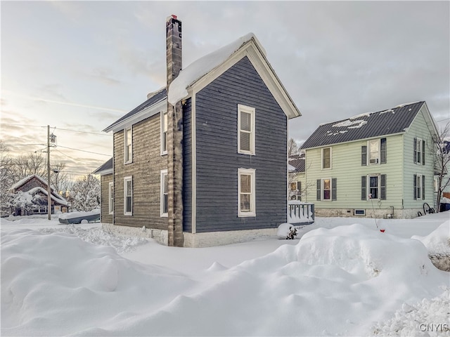 view of snow covered house