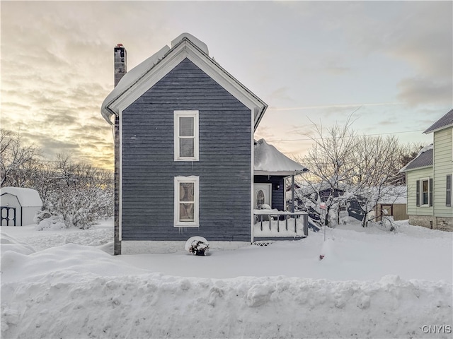 view of snow covered house