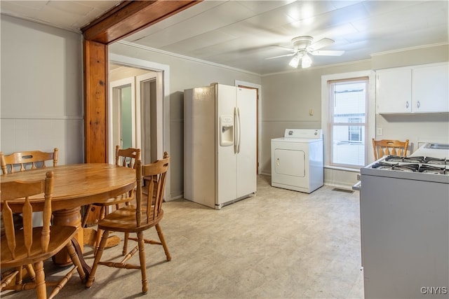 dining area featuring washer / clothes dryer, crown molding, ceiling fan, and light carpet