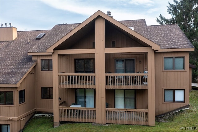 back of property featuring a balcony