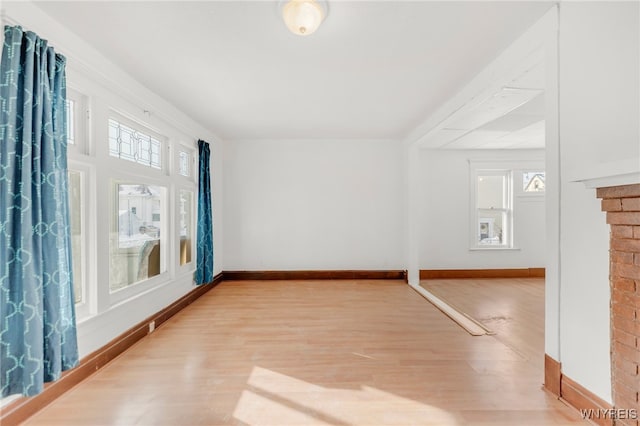 spare room with light hardwood / wood-style flooring