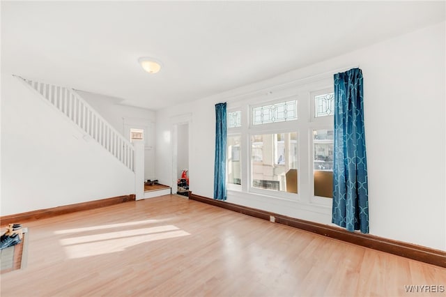 unfurnished room with hardwood / wood-style flooring