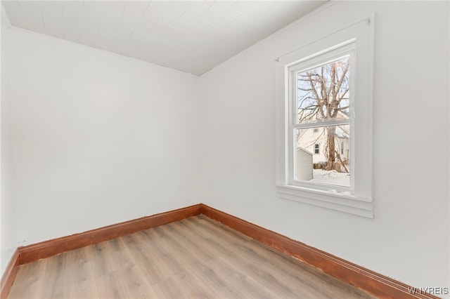 unfurnished room featuring hardwood / wood-style flooring