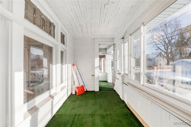 sunroom / solarium featuring wooden ceiling