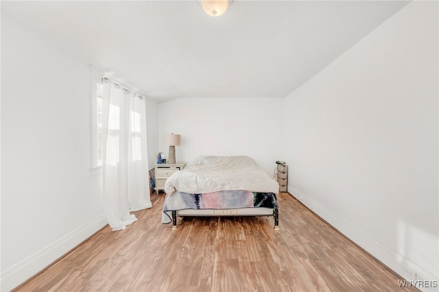 bedroom with hardwood / wood-style floors