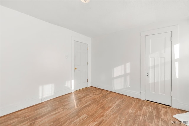 spare room with light hardwood / wood-style floors