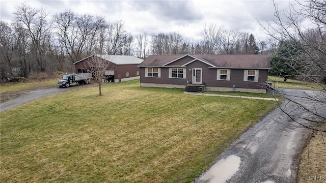 single story home with a front lawn