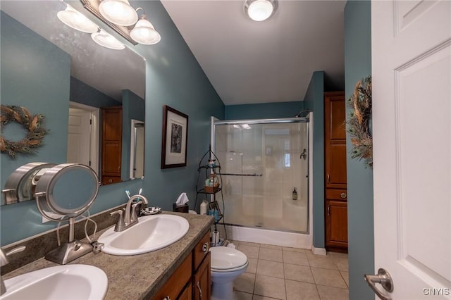 bathroom featuring tile patterned flooring, lofted ceiling, toilet, vanity, and a shower with shower door