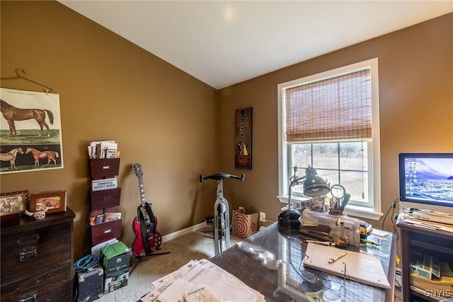 home office featuring carpet floors and vaulted ceiling