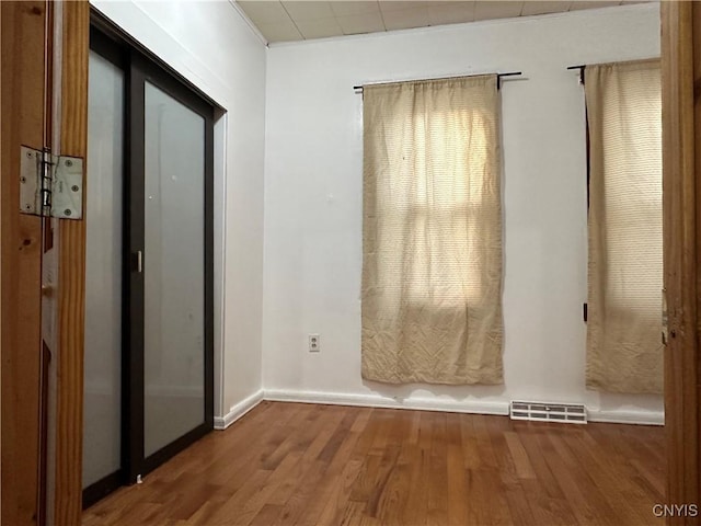 interior space featuring elevator and hardwood / wood-style floors