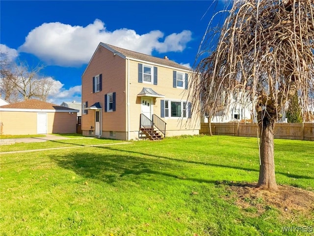 back of property featuring a lawn