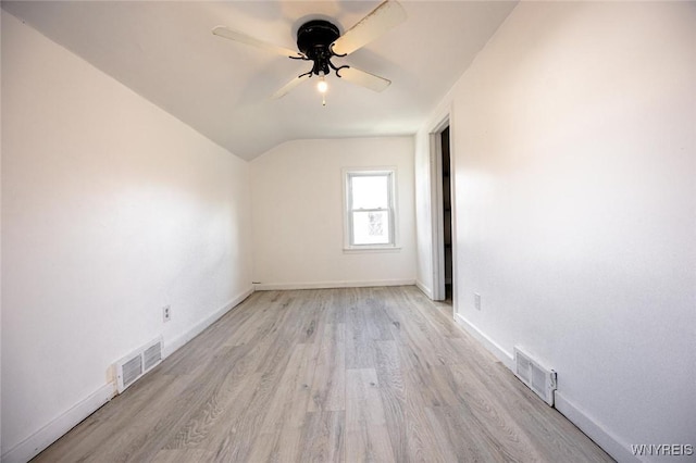 additional living space with ceiling fan, lofted ceiling, and light wood-type flooring