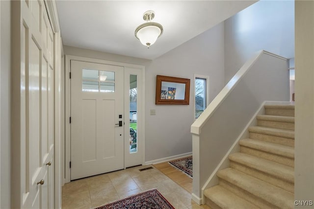 tiled entrance foyer featuring plenty of natural light