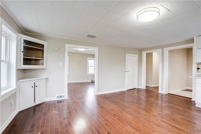 unfurnished living room with hardwood / wood-style floors