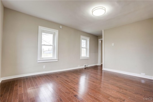 unfurnished room featuring dark hardwood / wood-style floors