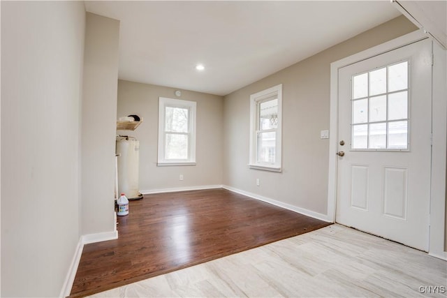 entrance foyer featuring light hardwood / wood-style floors and gas water heater