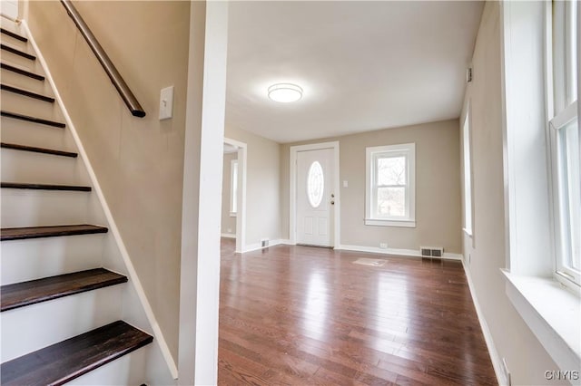 foyer with dark hardwood / wood-style floors