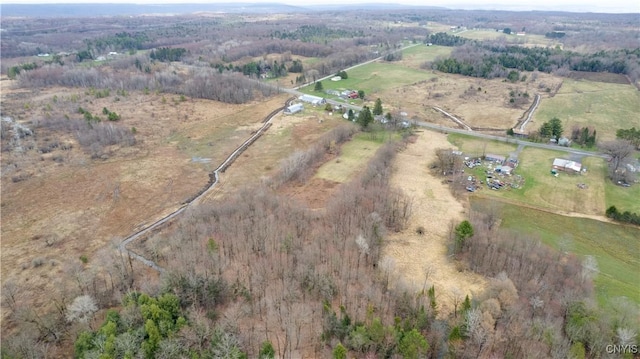 birds eye view of property with a rural view