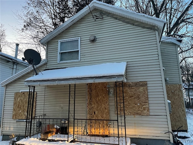 view of snow covered house