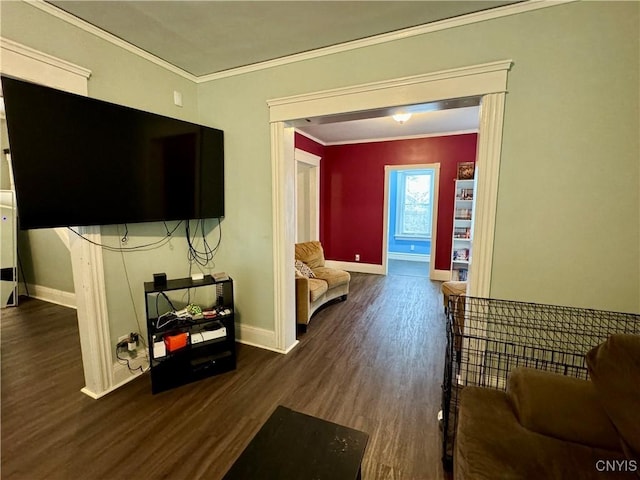 living room with dark hardwood / wood-style floors and crown molding