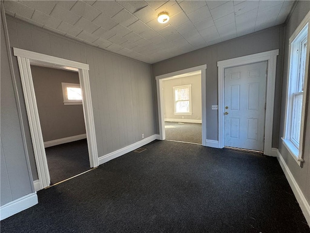 interior space with dark colored carpet