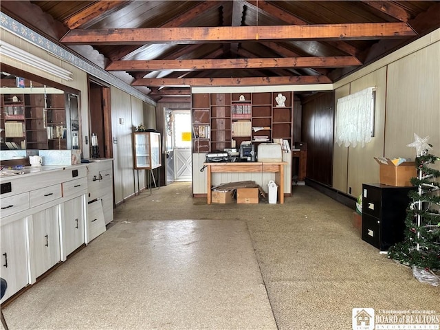 kitchen featuring vaulted ceiling with beams