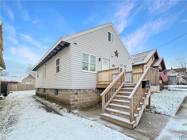 view of snow covered house