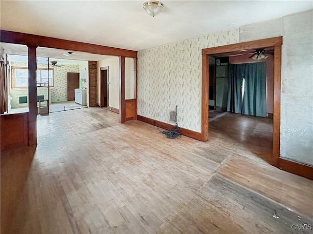 empty room featuring ceiling fan and wood-type flooring