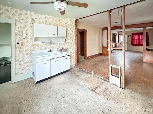 kitchen featuring white cabinets, ceiling fan, light hardwood / wood-style floors, and sink