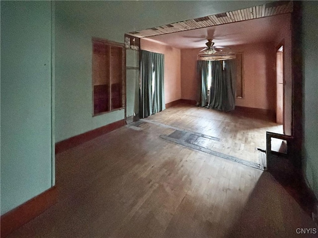 spare room with wood-type flooring and ceiling fan