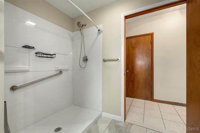 bathroom with a tile shower