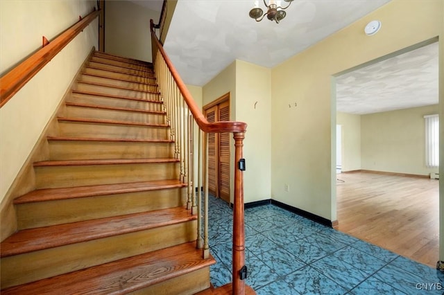 staircase with wood-type flooring