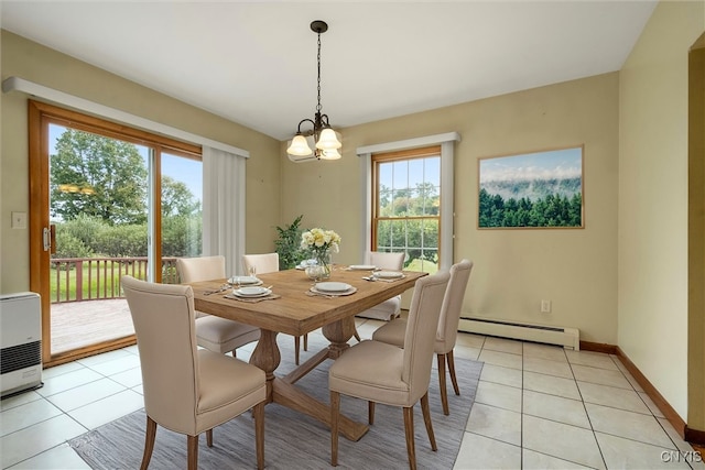 dining room featuring light tile patterned floors, an inviting chandelier, plenty of natural light, and baseboard heating