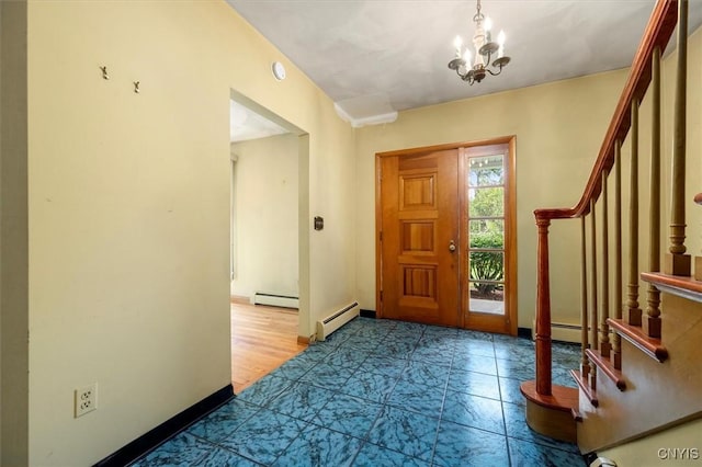 foyer entrance featuring hardwood / wood-style floors, a notable chandelier, and a baseboard heating unit