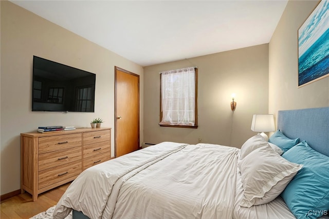 bedroom with light hardwood / wood-style flooring