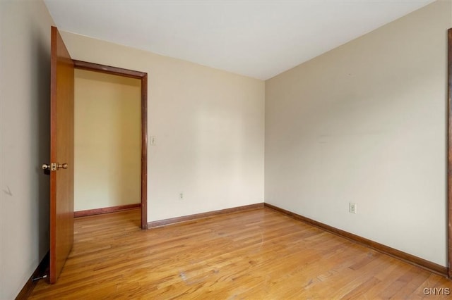 spare room with light wood-type flooring